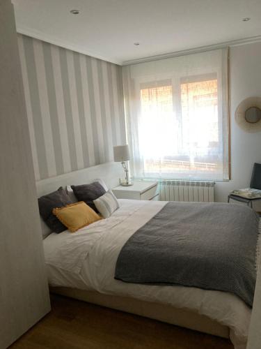 Un pat sau paturi într-o cameră la Ondartxo - ONGI ETORRI