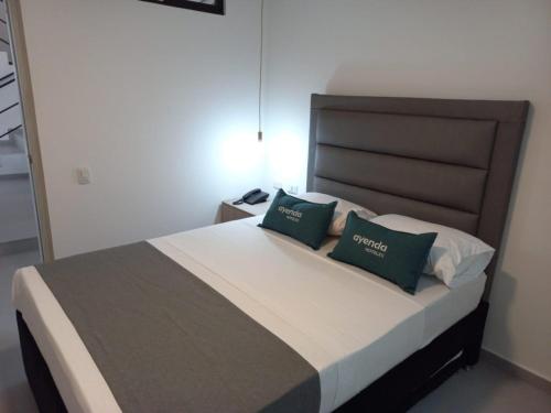 Postel nebo postele na pokoji v ubytování Hotel Colombia Avenida