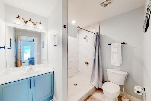 a bathroom with a sink and a toilet and a shower at San Flamingo 486 in Rodanthe