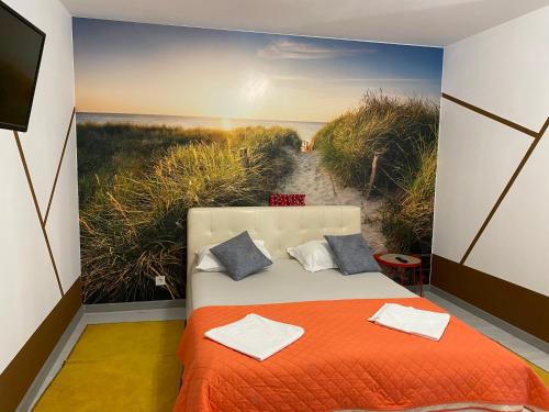 Un ou plusieurs lits dans un hébergement de l'établissement Garsoniera centrală lux Royal