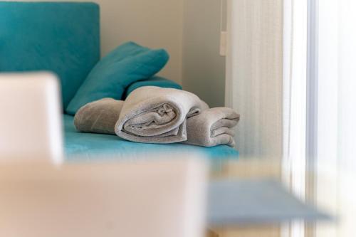 a towel on the floor in front of a mirror at OlivaBeachHouse - Direct Waterfront & Mooring in Barbat na Rabu