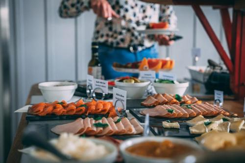 a table topped with lots of different types of food at Rimforsa Strand in Rimforsa