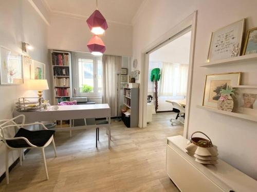 a living room with a desk and a mirror at 150m² Live/Work Unique&Sunlit Space in Athens in Athens
