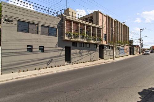 a building on the side of a street at +MS +Lujoso Loft +Inmejorable ubicación +Arcos loft 2 in Laborcillas