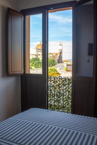 Ένα ή περισσότερα κρεβάτια σε δωμάτιο στο WEST SARDINIA APARTMENT 3