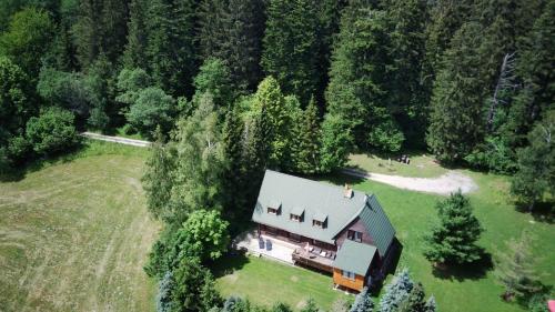 an aerial view of a house in the middle of a forest at Vrch Varta in Ružomberok