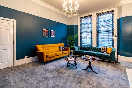 a living room with a couch and a table at St Johns, Wakefield - Self check in & free parking in Wakefield