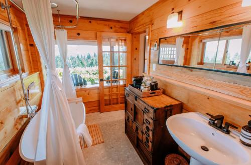 a bathroom with a sink and a toilet at Sakura Ridge the Farm & Lodge in Hood River