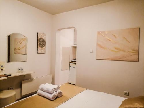 a white room with a sink and a kitchen at Petkov Family Hotel in Blagoevgrad