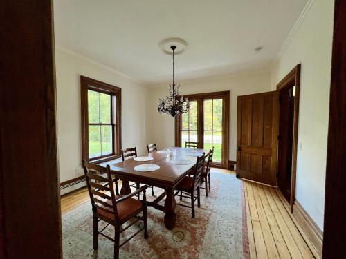 a dining room with a wooden table and chairs at Hill Farm Inn - Manchester in Sunderland