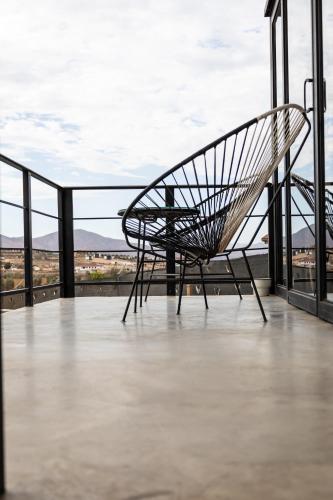 a bench sitting on the top of a building at Finca Cazosa in Valle de Guadalupe