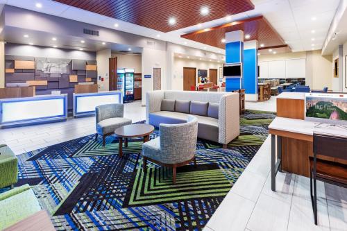 a lobby of a hospital with a couch and chairs at Holiday Inn Express & Suites - Houston - Downtown North by IHG in Houston