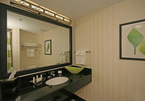 a bathroom with a sink and a large mirror at Fairfield Inn Suites Elkin Jonesville in Elkin