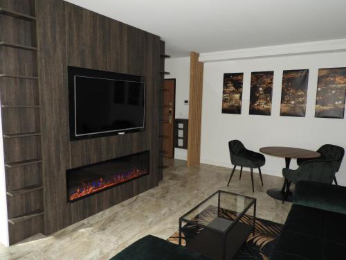 TV a/nebo společenská místnost v ubytování KMK Apartament