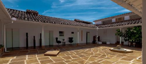 a courtyard of a house with a fountain at La Nube Posada in Barichara