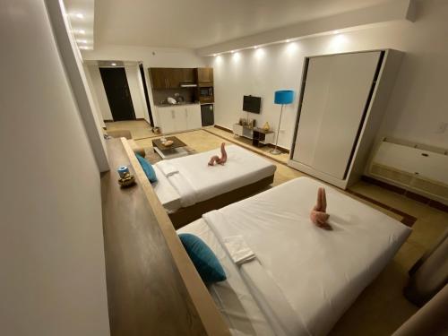 Ένα ή περισσότερα κρεβάτια σε δωμάτιο στο Alia Beach Residence