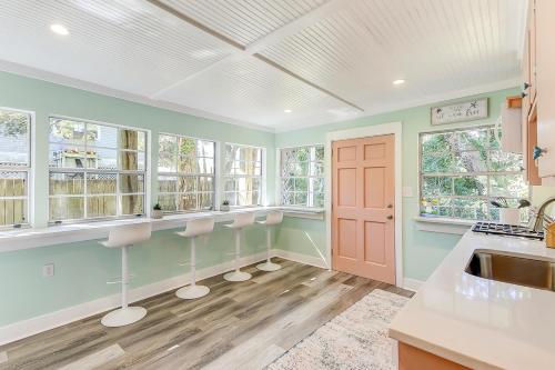 a kitchen with a sink and some windows at Surf Bungalow in Folly Beach