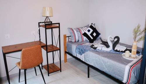 Ένα ή περισσότερα κρεβάτια σε δωμάτιο στο MLH Designer Suites @ Jesselton Quay CityPads