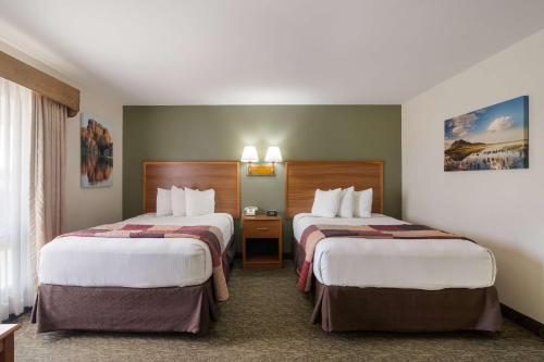 Postel nebo postele na pokoji v ubytování Best Western Graham's