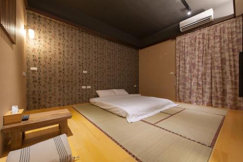 Postel nebo postele na pokoji v ubytování Muho B&B