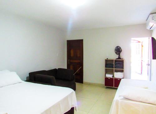 Postel nebo postele na pokoji v ubytování Casa a 140m da Praia do Sul com Wi-Fi em Ilheus BA