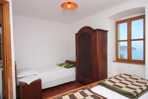 Ένα ή περισσότερα κρεβάτια σε δωμάτιο στο Apartment Beli 8094b