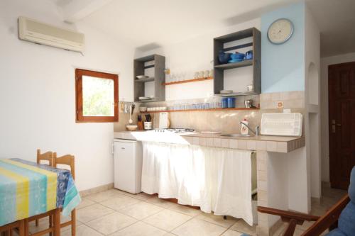a kitchen with a sink and a counter top at Apartments by the sea Milna, Vis - 8943 in Rukavac