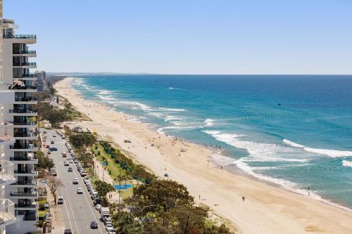 an aerial view of a beach and the ocean at Meriton Suites Surfers Paradise in Gold Coast