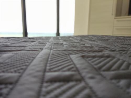 a close up of a bed in a room at Departamento Suite frente al mar Poseidon Manta in Manta