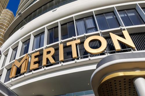 a sign on top of a merriott hotel at Meriton Suites Surfers Paradise in Gold Coast