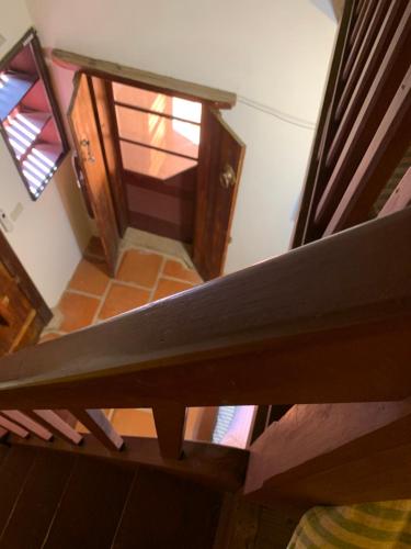an overhead view of a wooden staircase with a door at Yamaharuka Historic House in Jinhu