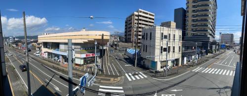 a view of a city street with buildings at SLEEEP Fuji in Fujinomiya