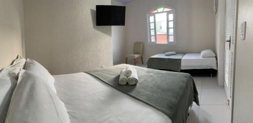 Postel nebo postele na pokoji v ubytování Pousada EntreMares -Centro-