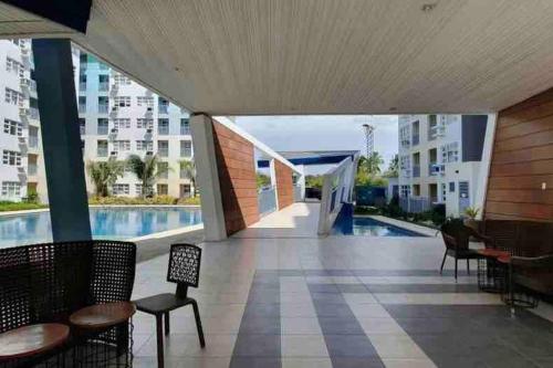 a view of a swimming pool in a building at Seawind Condominium 2BR unit in Davao City