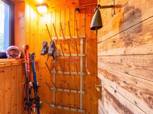 a room with a wall with skis on it at Apartment in Bichlbach near Ski Slopes in Bichlbach