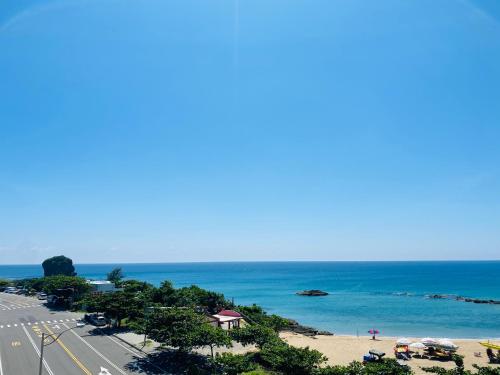 a view of a beach and the ocean at Minimi Inn-Sailrock Beach House in Eluan