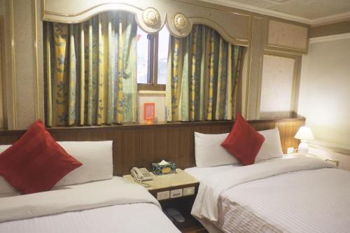 Postel nebo postele na pokoji v ubytování Fu Chang Hotel