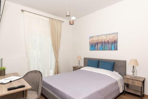 Postel nebo postele na pokoji v ubytování Cozy Corner - Central Stylish Apartment