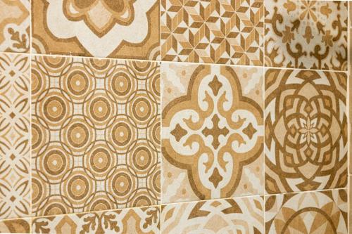 a group of different types of tiles on a wall at L’Ancora Suite in Jávea