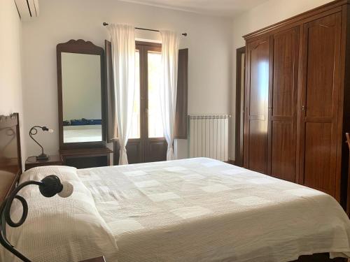 Ένα ή περισσότερα κρεβάτια σε δωμάτιο στο Agriturismo San Pietro