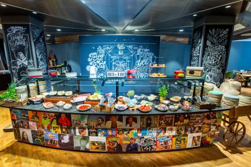a display case with food on it in a store at mightyTwice Hotel Dresden in Dresden