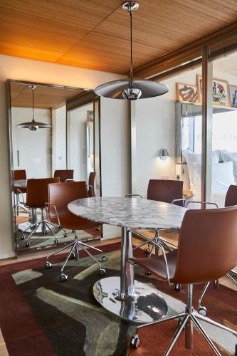 a conference room with a table and chairs at Villa M in Paris