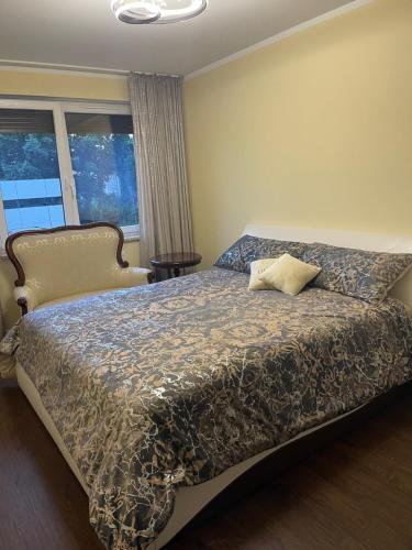 a bedroom with a bed with a pillow on it at Luxury Maślice Apartment in Wrocław