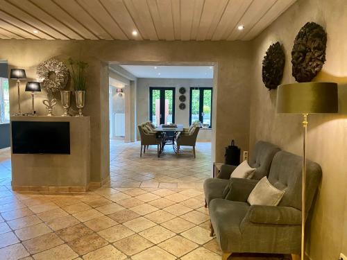 a living room with a couch and a table at country-suites by verdino LIVING - Apartments & Privatzimmer in Braunlage