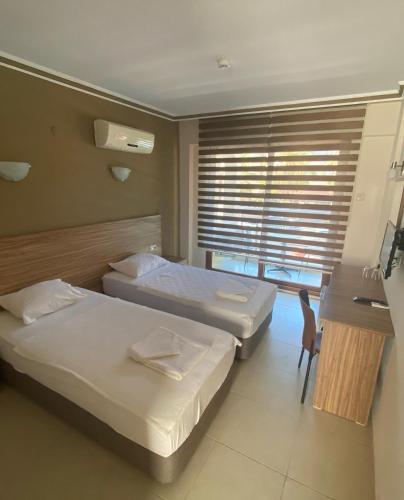 Ένα ή περισσότερα κρεβάτια σε δωμάτιο στο Astoria Life Hotel
