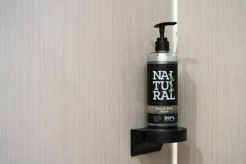 a mouthwash bottle is hanging on a wall at Aberystwyth Park Lodge Hotel in Aberystwyth