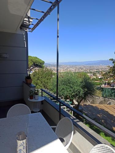 a table and chairs on a balcony with a view at La Terrazza Quisisana Sorrento Coast in Castellammare di Stabia