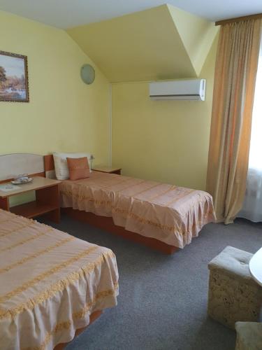 Ένα ή περισσότερα κρεβάτια σε δωμάτιο στο Vila Queen