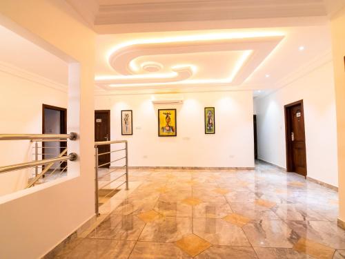 a large room with a ceiling with a spiral at KoKo Palm Inn LTD in Accra