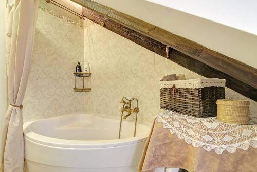 a bathroom with a bath tub and a sink at MAIN CENTRAL SQUARE guest house in Dubrovnik